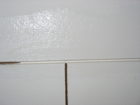 Partially painted acoustic ceiling tiles